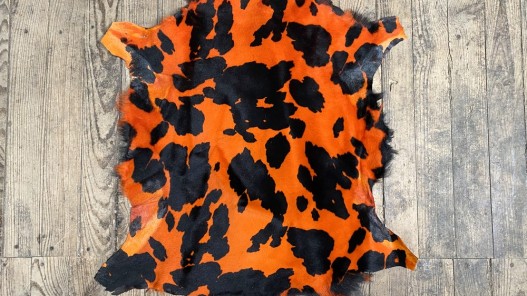 Peau de mouton lainé façon camouflage orange - Cuir en Stock