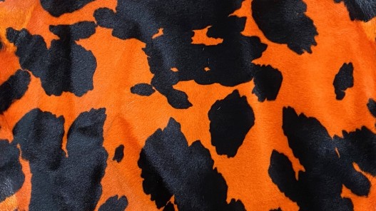 Peau de mouton lainé façon camouflage orange - Cuir en stock